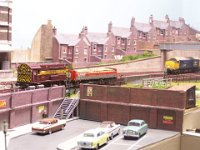 100 5088  Above the Uphall Station car-park, Class 09 023 shunts a single OBA wagonload of timber