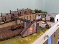 UP DKM-12  A footbridge provides access from the houses, over the tracks and on to Uphall Station. The industrial building on the right belongs to THE OBLONG BOX COMPANY, which crafted from a SCALESCENES download