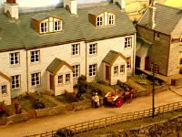 Milko chatting with Mrs. Mop at the gate of railway workers cottages          Paul Plowman  Milko chatting with Mrs. Mop at the gate of railway workers cottages         photo Paul Plowman