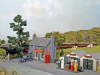 PICT0021 A  A  Country Post Office and Garage at St.Gabriels Halt level crossing. A V1 2-6-2T hauling branch passenger can be glimpsed through the trees on the level crossing.